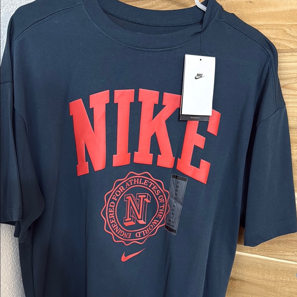 Nike Dark Blue Tee with Vibrant Red Emblem